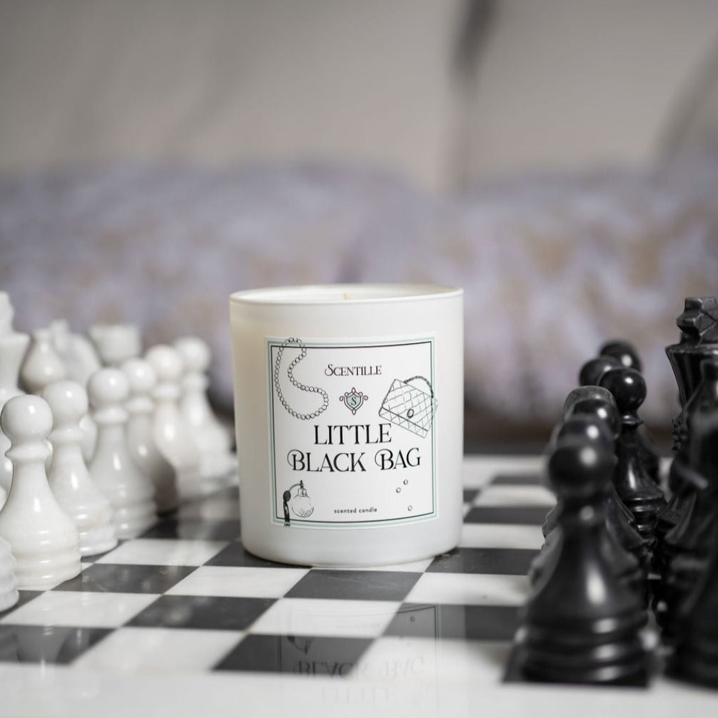 Little Black Bag Candle on a chessboard