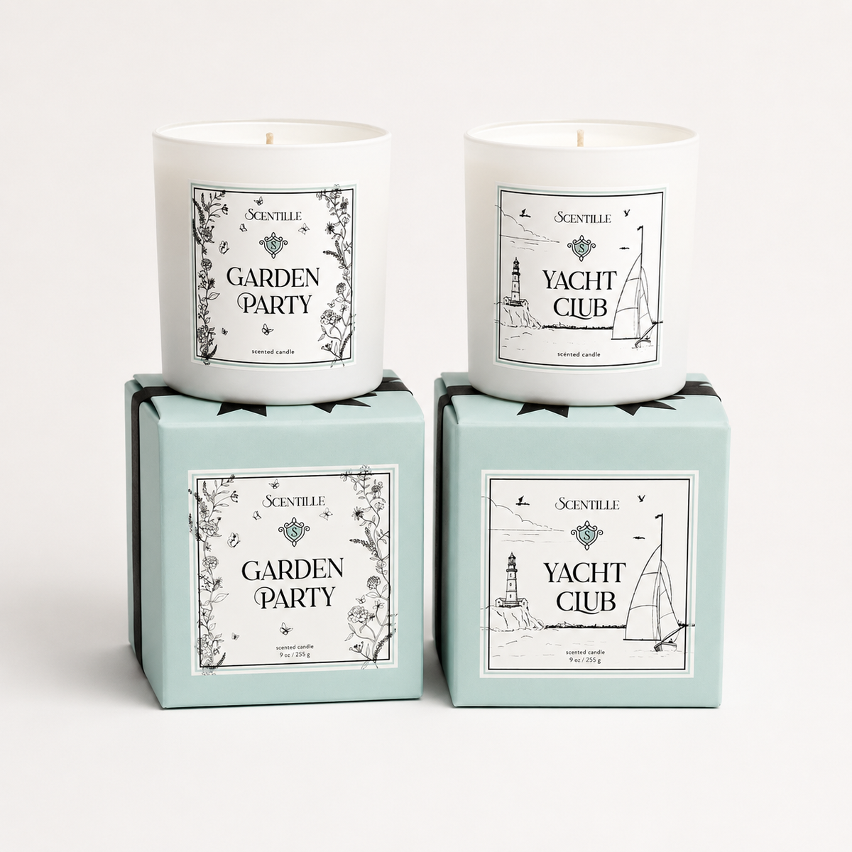 Two candles in boxes labeled 'Yacht Club' and 'Garden Party' on a white background
