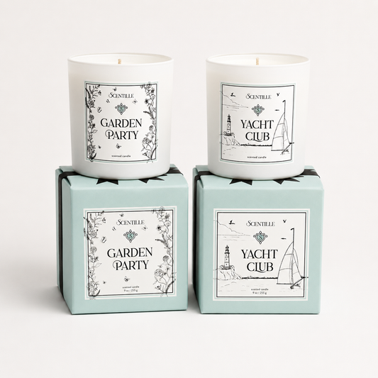 Two candles in boxes labeled 'Yacht Club' and 'Garden Party' on a white background
