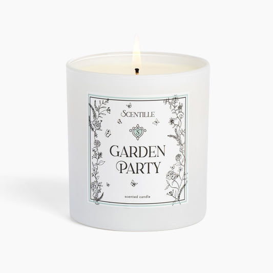 A lit Garden Party candle from Scentille