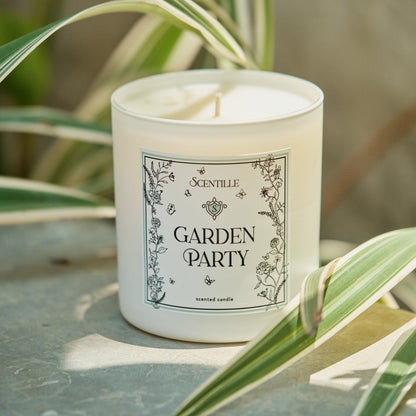 A Garden Party candle in a sunny garden